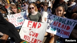 FILE - Students who walked out of their Montgomery County, Maryland, schools protest against gun violence in front of the White House in Washington, Feb. 21, 2018. 