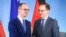 German Foreign Minister Heiko Maas (R) and his counterpart from Albania, Dimitir Bushati (L) shake hands after a joint press conference after a meeting at the foreign ministry in Berlin, Germany, July 30, 2018.