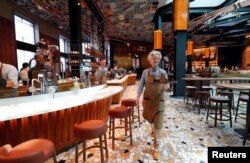 Employees work inside the new Starbucks Reserve Roastery flagship in downtown Milan, Italy, Sept. 4, 2018.