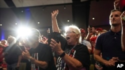 Supporters cheer as Republican presidential nominee former President Donald Trump speaks at a campaign event Sept. 28, 2024, in Prairie du Chien, Wis.