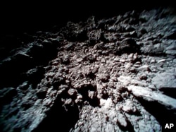 This Sept. 23, 2018 image captured by Rover-1B, and provided by the Japan Aerospace Exploration Agency (JAXA) shows the surface of asteroid Ryugu. (JAXA via AP)