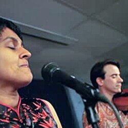 Irish violinist Colm O'Riain and his wife, Pireeni Sundaralingam, a Sri Lankan Tamil poet, performing together