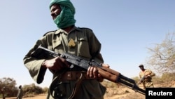 FILE - A soldier preparing to fight terrorists in the Sahel trains with U.S. advisers near Goa, Mali, in 2006. Terror attacks claimed by Islamist militants against civilians and military targets have risen recently in Burkina Faso, Mali and Niger.