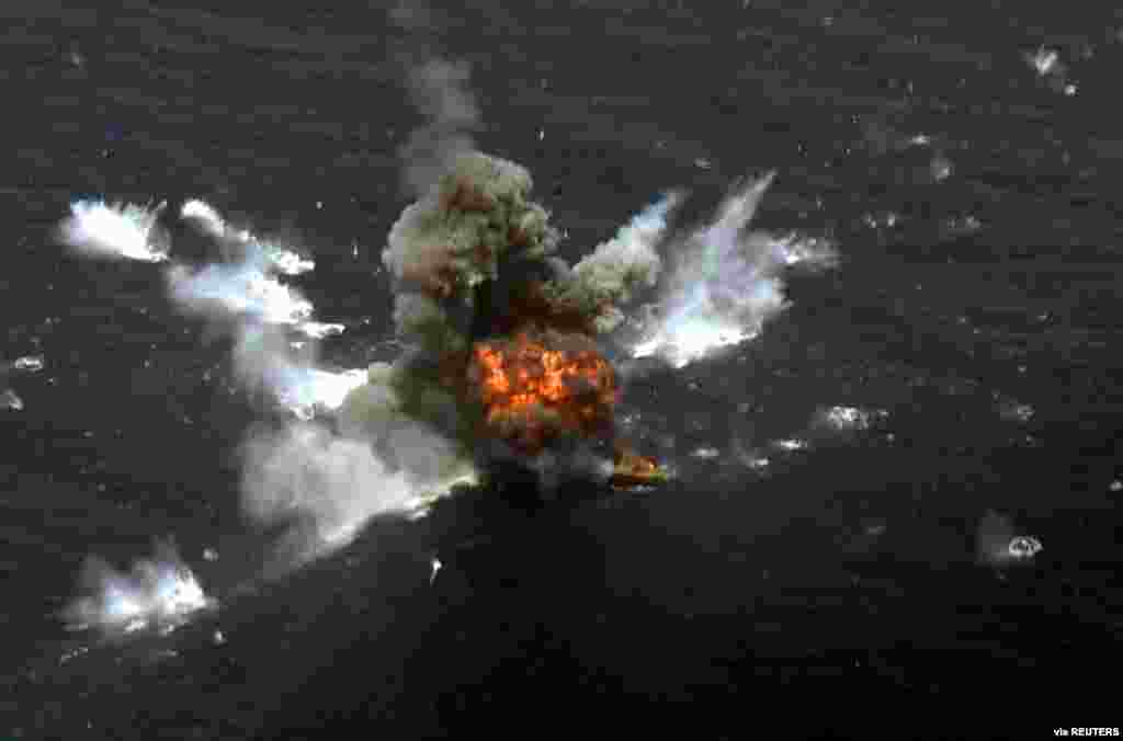 An explosion is seen after a new Iranian-made cruise missile was fired during war games in the northern Indian Ocean and near the entrance to the Gulf, Iran, June 17, 2020.