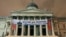 Greenpeace protesters scale the pillars of the National Gallery in central London, February 21, 2012, as they unfurl a banner in protest at oil firm Shell's plans for drilling oil in the Arctic region. 