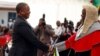 Retired Commander of Zimbabwe Defense Forces (ZDF) General Constatino Chiwenga is congratulated by Chief Justice Luke Malaba after taking an oath of office as vice president at State House in Harare, Dec. 28, 2017. 