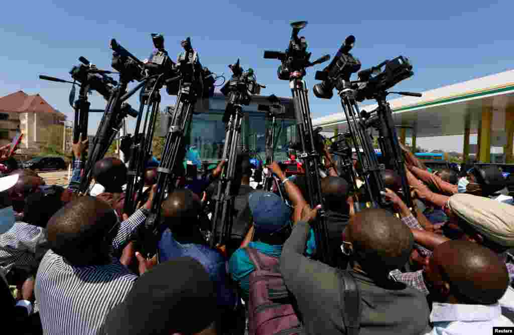 Media members cover the unveiling of the National Gas Expansion Program in Abuja, Nigeria.