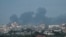 TOPSHOT - Smoke billows following Israeli bombardment north of Nuseirat in the central Gaza Strip on April 27, 2024, amid the ongoing conflict in the Palestinian territory between Israel and the militant group Hamas.