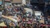 Shoppers and market vendors fill Sani Abacha Street in central Freetown, Sierra Leone, Jan. 4, 2013.