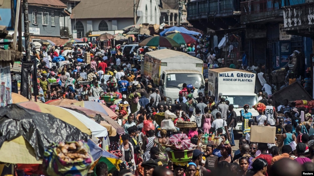 Shoppers and market vendors fill Sani Abacha Street in central Freetown, Sierra Leone, Jan. 4, 2013.