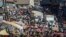 Shoppers and market vendors fill Sani Abacha Street in central Freetown, Sierra Leone, Jan. 4, 2013.