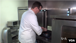 Chris Spear, founder of Chefs Without Restaurants, working in a kitchen.