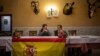 Vox's Ciudad Real provincial candidate Ricardo Chamorro, left, and Toyan Patón during a meeting with local farmers at a bar in Brazatortas, on the edge of the Alcudia valley, central Spainو April 10, 2019.