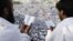 Muslim pilgrims pray on a rocky hill called the Mountain of Mercy, on the Plain of Arafat near the holy city of Mecca, Saudi Arabia, Oct. 25, 2012.