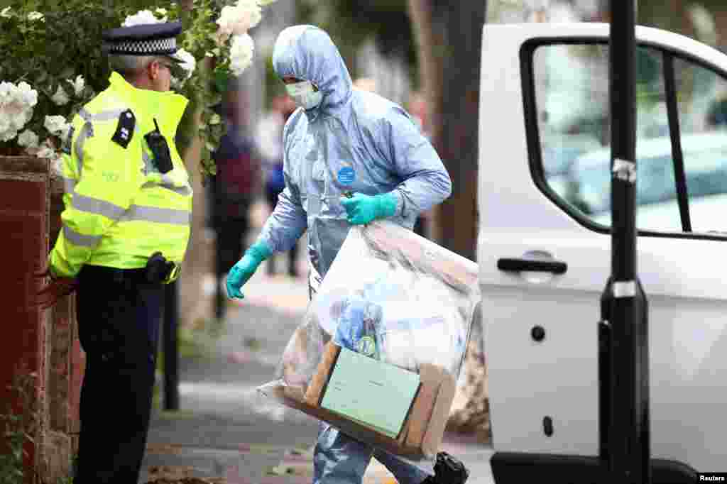 Forensics investigators work at a property which was raided by police in East Ham, east London, June 5, 2017.
