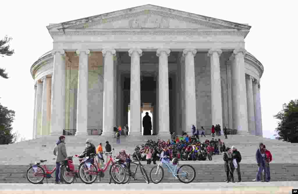 People gather at the Thomas Jefferson Memorial, Washington, D.C.&nbsp; Temperatures hovered around 45 degrees (F) with the first day of Spring a week away.