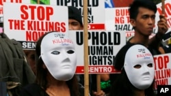 Maskirani demonstranti na Filipinima zahtevaju prestanak ubistava u ratu protiv droge, Manila 10. decembar 2016. 