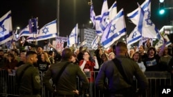 FILE— People protest against Israeli Prime Minister Benjamin Netanyahu's government in Tel Aviv, Israel, Saturday, March 2, 2024.