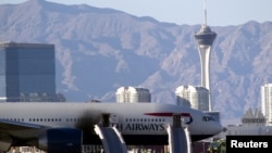 Soot darkens the door of a British Airways passenger jet after a fire at McCarran International Airport in Las Vegas, Nev., Sept. 8, 2015. Only minor injuries were reported among 172 people aboard.