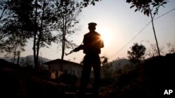  A Kachin Independence army rebel stands at frontline outpost facing no man's land in Lawa Yang, outside of Laiza, the armed group's headquarters in northern Kachin state, Myanmar, March 20, 2018. The war between Myanmar’s government forces and the Kachins is one of the longest-running wars on Earth, and it has intensified dramatically in recent months, with at least 10,000 people been displaced since January alone, according to the United Nations.