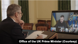 In this photo taken from video on March 15, 2025, British Prime Minister Keir Starmer participates from London in a virtual meeting with a group of European, Australian, New Zealand and Canadian leaders. They discussed the proposed ceasefire between Russia and Ukraine.