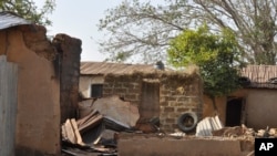 FILE - A house is left burned following an attack by gunmen in Bokkos, Nigeria, on Dec. 26, 2023. Officials said at least 140 people were killed in remote villages in Nigeria's Plateau state. A National Day of Mourning was held May 28, 2024, to honor victims of violence in 2023.