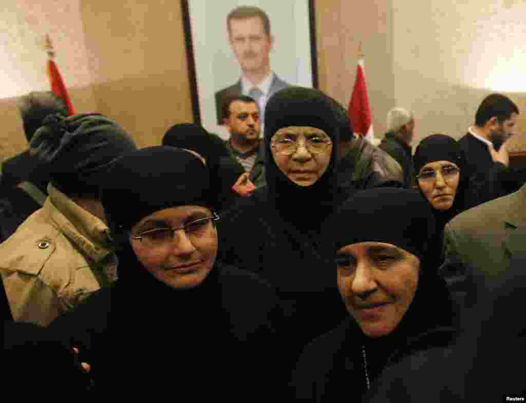 About a dozen nuns, who were freed after being held by rebels for over three months, arrive at the Syrian border with Lebanon at the Jdaydeh Yaboos crossing, Syria.