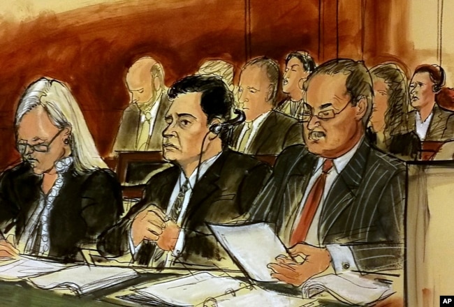 In this courtroom sketch Mehmet Hakan Atilla, second from left, listens to the judge during his sentencing, flanked by his attorneys Cathy Fleming, left, and Victor Rocco as Atilla's wife listens to the proceedings, May 16, 2018, in New York.