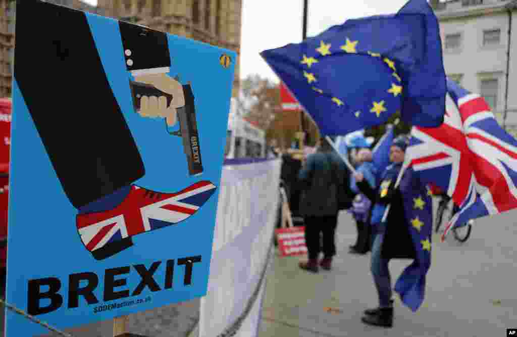 Protesters gathered across from Parliament demonstrate against Britain's Brexit split from Europe, in London.