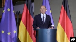 FILE - German Chancellor Olaf Scholz delivers a statement after a meeting with government leaders in Berlin, Nov. 6, 2024.