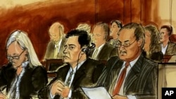 In this courtroom sketch Mehmet Hakan Atilla, second from left, listens to the judge during his sentencing, flanked by his attorneys Cathy Fleming, left, and Victor Rocco, May 16, 2018, in New York. 