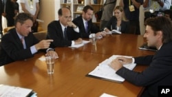 French finance minister Francois Baroin, right, listens to U.S. treasury secretary Timothy Geithner, left, during talks in Marseille. Finance Ministers from the Group of Seven leading economies gathered in France amid jitters about Europe's debt crisis a