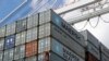 FILE - containers wait to be unloaded from a ship at the Port of Baltimore in Baltimore, Maryland. 