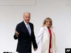 Vice President Joe Biden and his wife Jill walk along the colonnades of the White House in Washington, Jan. 20, 2017, before the start of presidential inaugural festivities for the incoming 45th President of the United States Donald Trump.