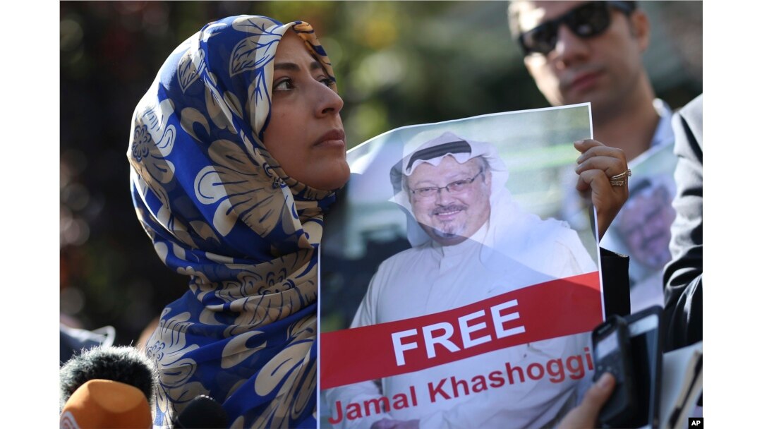 Tawakkol Karman, the Nobel Peace Prize laureate for 2011 holds a picture of missing Saudi writer Jamal Khashoggi as she speaks to journalists near the Saudi Arabia consulate, in Istanbul, Turkey.