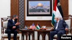 U.S. Secretary of State Antony Blinken speaks with Palestinian President Mahmoud Abbas