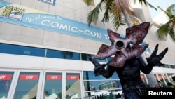 David Schoelen poses dressed like the character of Demogorgon from "Stranger Things" during the 2017 Comic-Con International Convention in San Diego, California, July 20, 2017. 