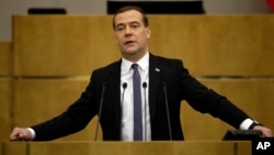 Russian Prime Minister Dmitry Medvedev addresses the State Duma, lower parliament chamber, with annual report on country's economic and social development in Moscow on April 22, 2014.