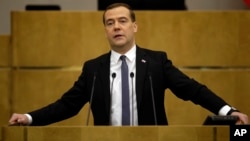 Russian Prime Minister Dmitry Medvedev addresses the State Duma, lower parliament chamber, with annual report on country's economic and social development in Moscow on April 22, 2014.