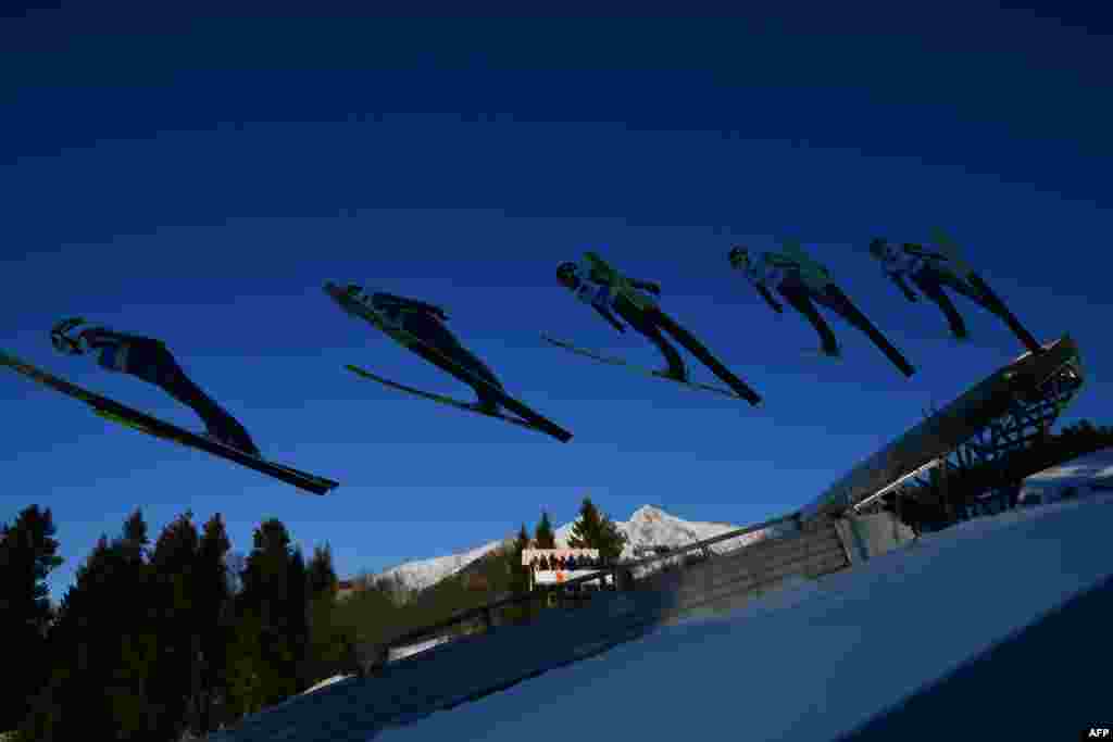 This multi-exposure picture shows Germany's Anna Rupprecht soaring in the air during the women's ski jumping event at the FIS Nordic World Ski Championships in Seefeld, Austria.