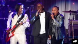 FILE - Verdine White, from left, Philip Bailey and Ralph Johnson of Earth, Wind and Fire perform at the 2016 Clive Davis Pre-Grammy Gala in Beverly Hills, California, Feb. 14, 2016.