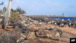 This photo provided by Broadcom Broadcasting shows a damaged area in Nuku’alofa, Tonga, Jan. 20, 2022, after Saturday's volcanic eruption near the Pacific archipelago. 