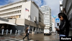 Pedestrians are seen near the U.S. Embassy in Tel Aviv, Israel, Dec. 6, 2017.