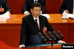 FILE - Chinese President Xi Jinping speaks at the closing session of the National People's Congress (NPC) at the Great Hall of the People in Beijing, China, March 20, 2018.