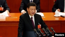 FILE - Chinese President Xi Jinping speaks at the closing session of the National People's Congress at the Great Hall of the People in Beijing, China, March 20, 2018.