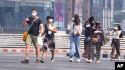 Tourists wear masks in Chiang Mai province, Thailand, April 2, 2019.
