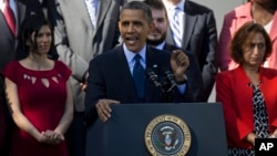 President Barack Obama gestures while speaking about the initial rollout of the health care overhaul, in the Rose Garden of the White House in Washington, Oct. 21, 2013.
