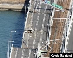 A bridge connecting Kansai airport, damaged by a 2,591-ton tanker, which struck it in strong winds caused by Typhoon Jebi, in Izumisano, Japan, Sept. 5, 2018.