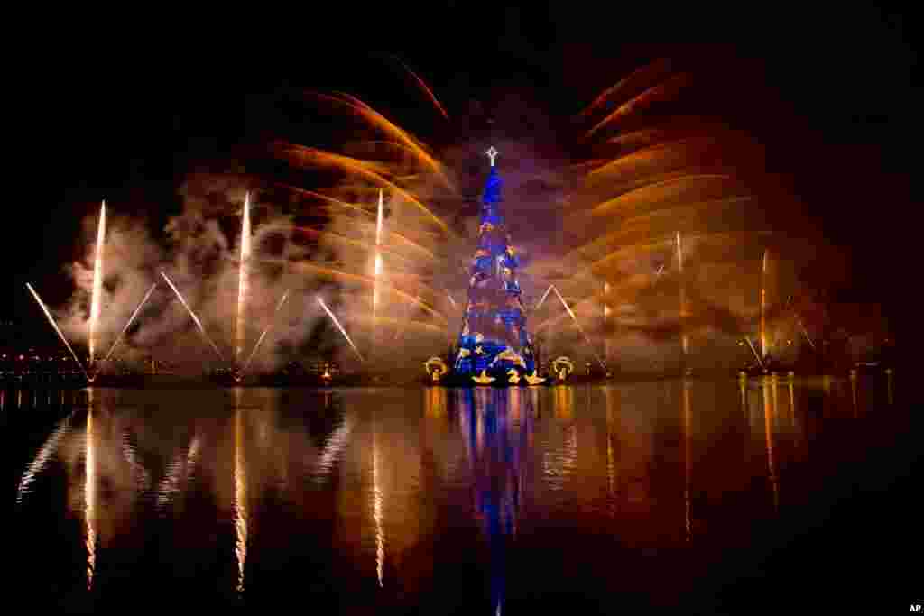 Fireworks explode over a floating Christmas tree in Lagoa lake at the annual holiday tree lighting event in Rio de Janeiro, Brazil, Nov. 30, 2013.