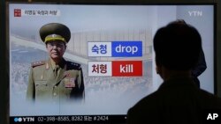 A man watches a TV screen showing a file picture of Ri Yong Gil, the former head of North Korea's military, at the Seoul Railway Station in Seoul, South Korea, May 11, 2016. 